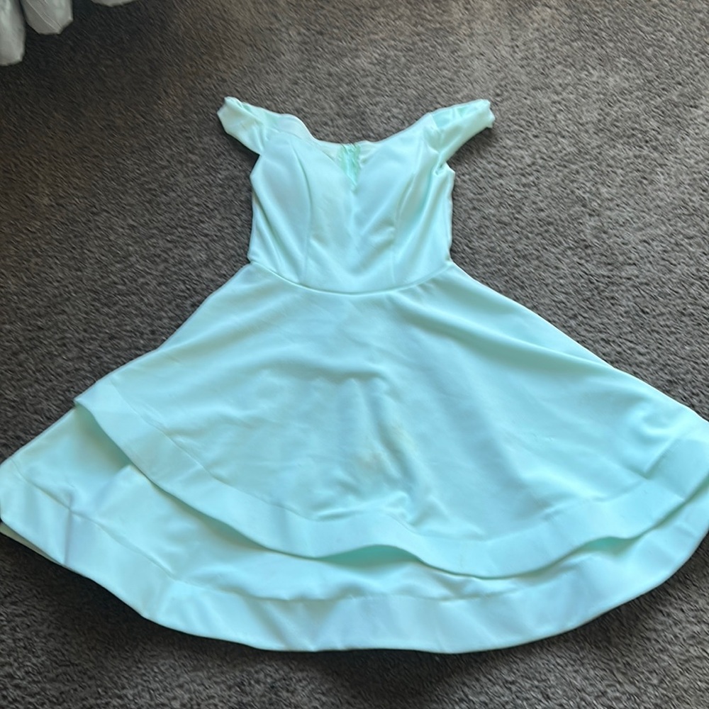 Light teal beautiful skirt and very cute cut at the top worn once